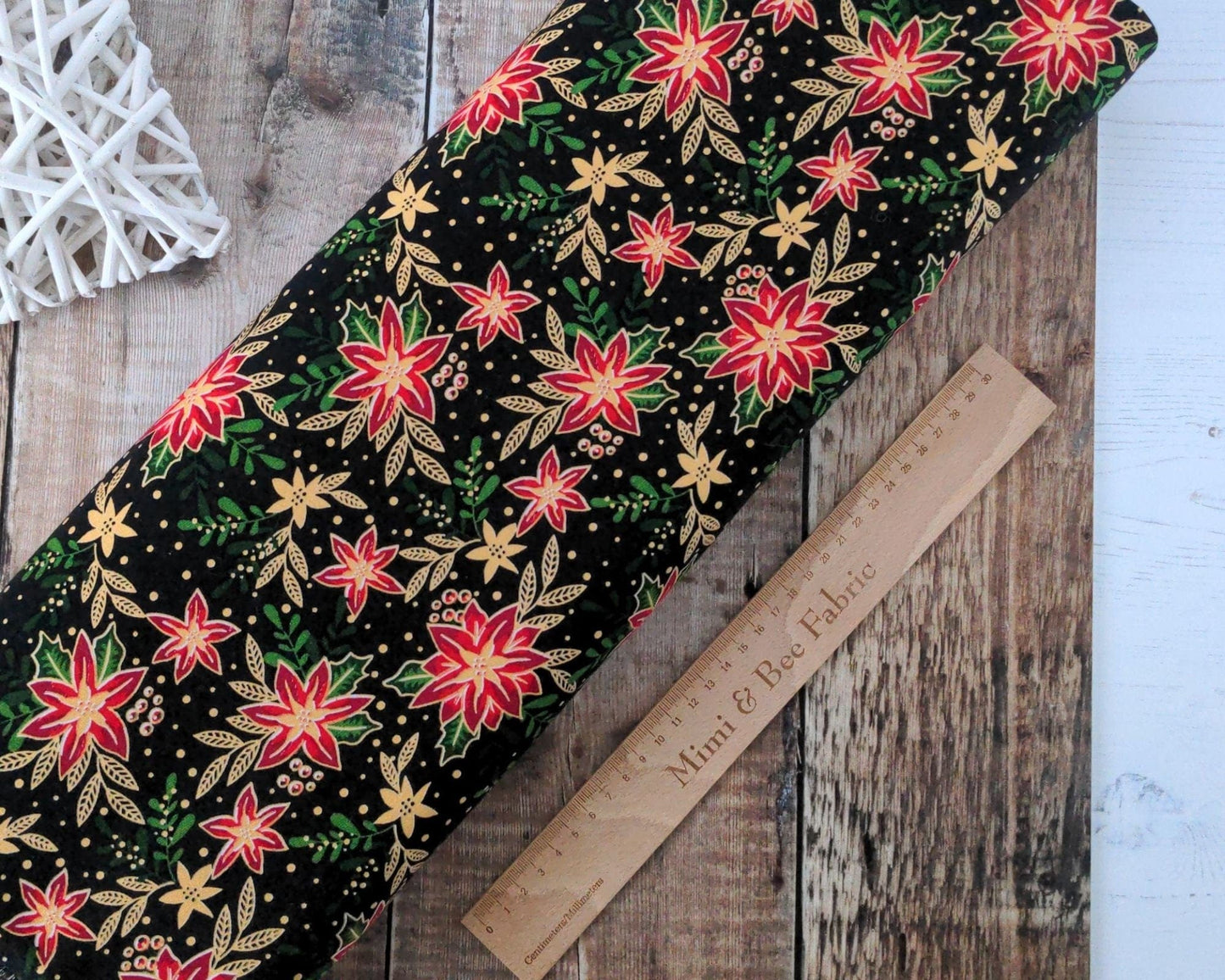 Fabric Winter floral holly and poinsettia with metallic gold on black 100% cotton - 2806-01 CraftCottonCo