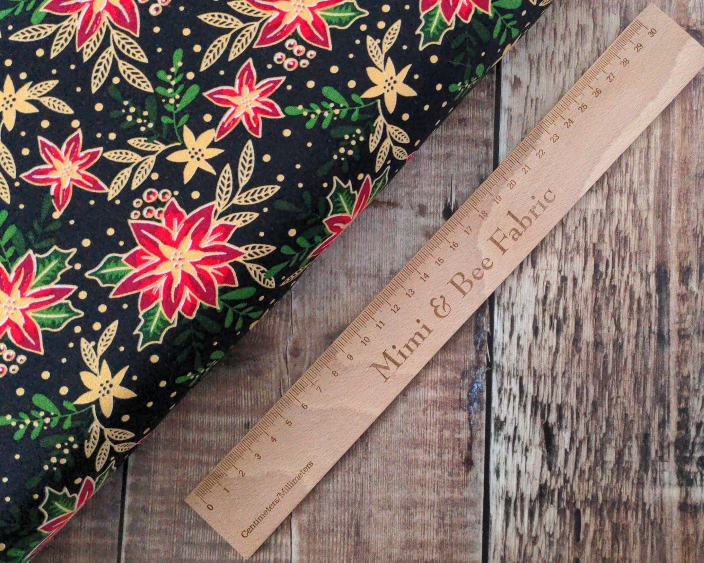 Fabric Winter floral holly and poinsettia with metallic gold on black 100% cotton - 2806-01 CraftCottonCo