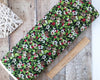 Fabric Winter green foliage red berry fabric with pine cones on 100% quilting cotton fabric - Northcott