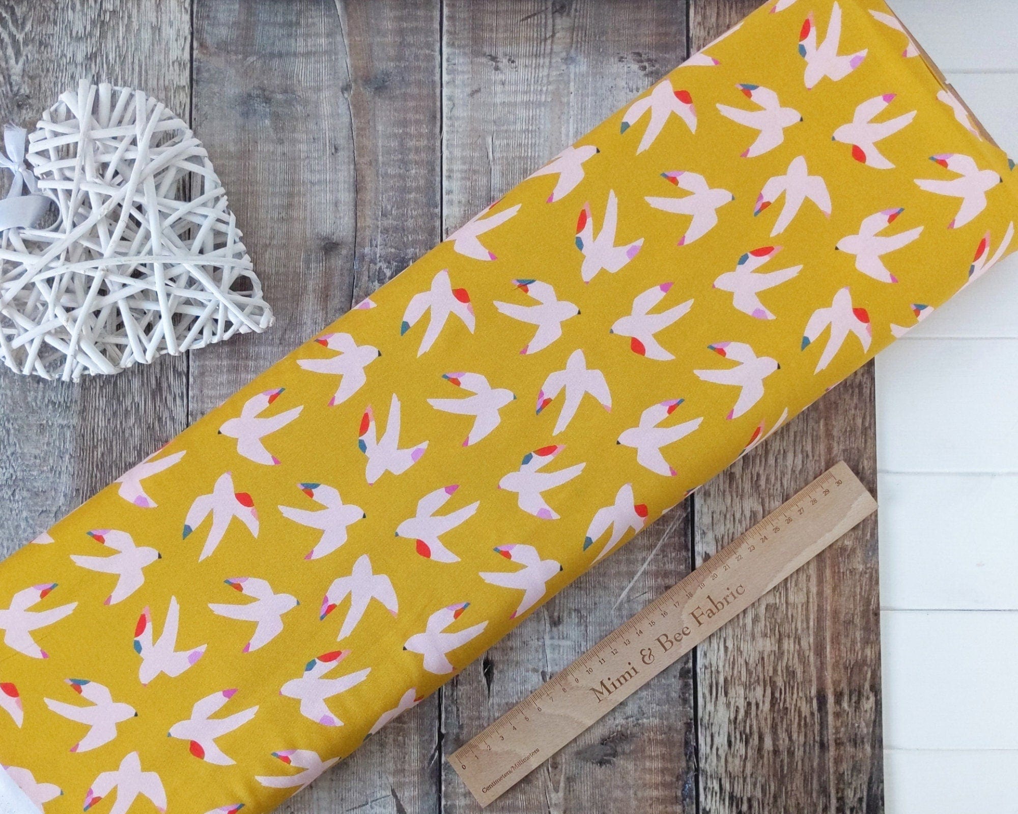 Fabric Yellow rayon dressmaking fabric with pink birds - 'Bold' Dashwood Studio